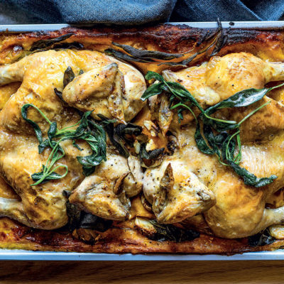 Roast butterflied chickens on pumpkin polenta