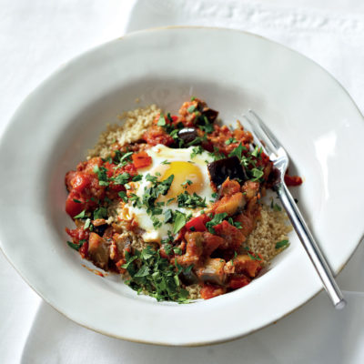 Spicy poached eggs with pepper, brinjal and tomato