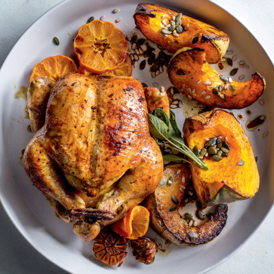 Sticky ClemenGold-glazed roast chicken with pumpkin wedges