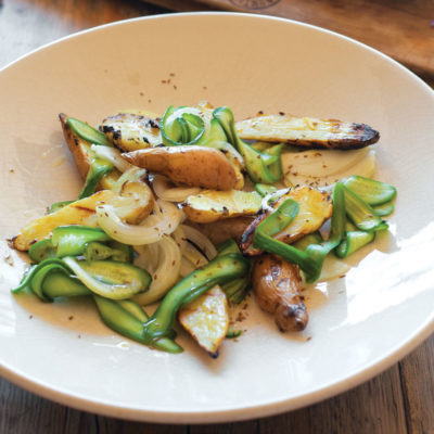 Grilled pink fir potatoes with pickled cucumber salad