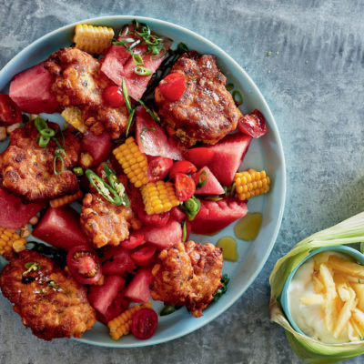 Spicy corn fritters with watermelon salad