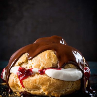 Chocolate éclairs with cherry jam