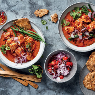 Tomato-and-yoghurt fish curry with green beans and Indian fried bread