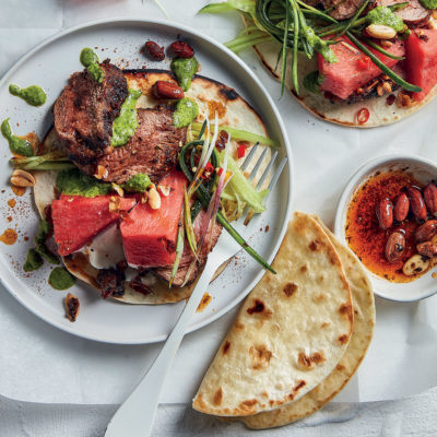 Spicy pork tacos with watermelon, coriander salsa verde and peanuts