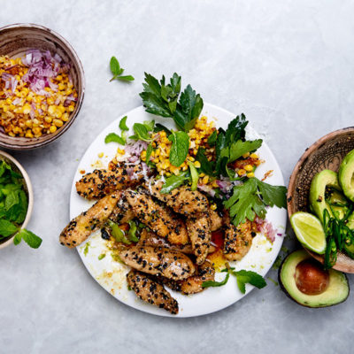 Sesame chicken strips with corn and avo