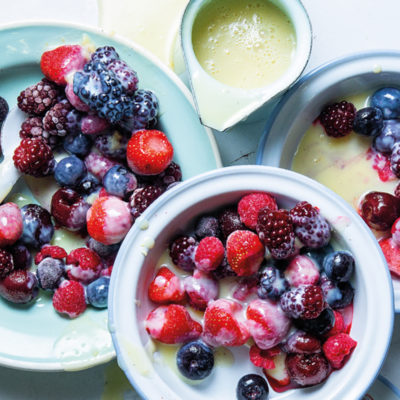 Frozen berries with hot condensed milk sauce