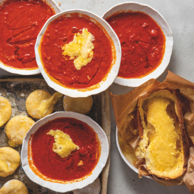 Potato bread, tomato soup and roasted raclette