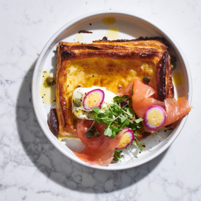 Smoked salmon blini tart with beetroot-stained quail's eggs