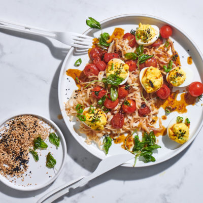 Spicy Asian stuffed eggs with noodles