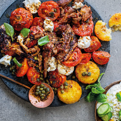 Pull-apart lamb shank with roast tomato salad and tzatziki