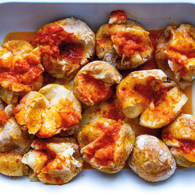 Salt-baked potatoes with harissa butter