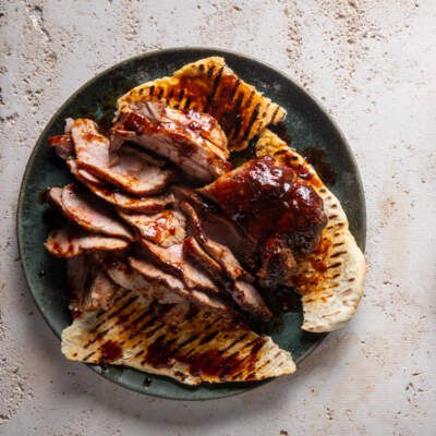 Smoky pork rib-eye steaks with flatbreads