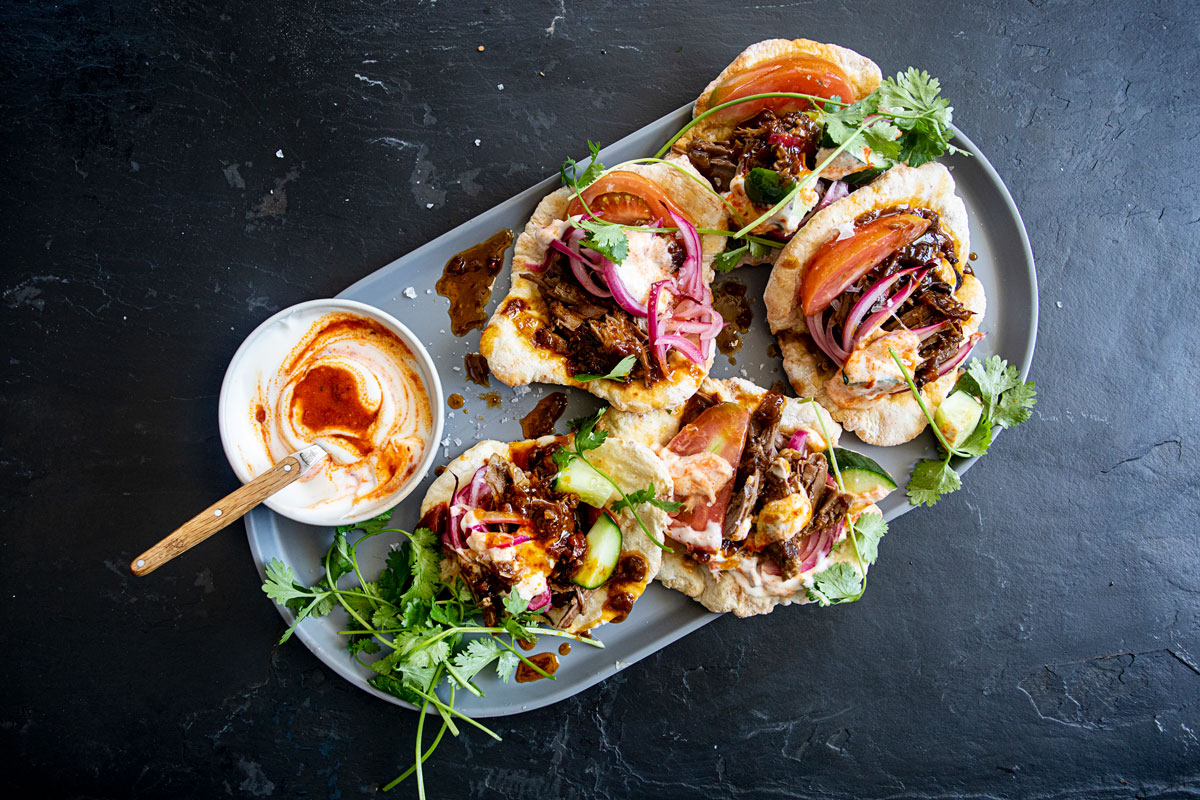 Apricot-and-rose harissa slow-cooked lamb gyros