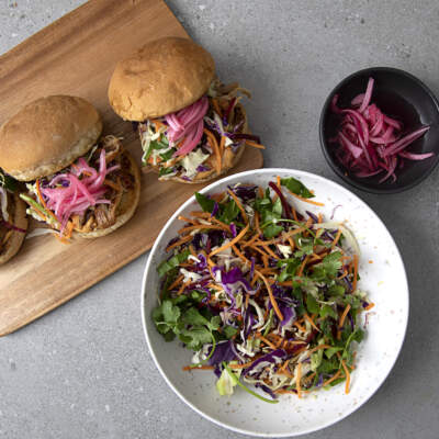 Easy pulled pork with rainbow slaw on a bun