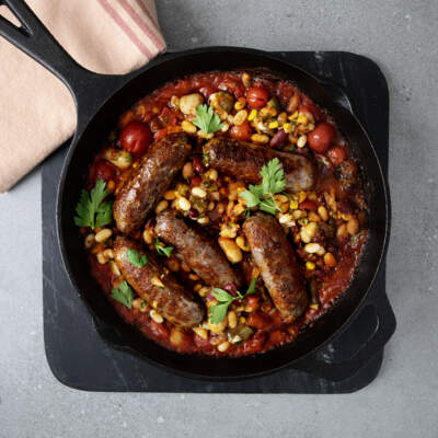 Sausage and tomato bake with the smokey bean salad