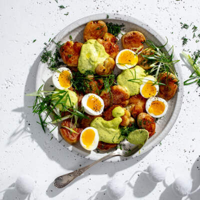 Roast potatoes with devilled egg dressing