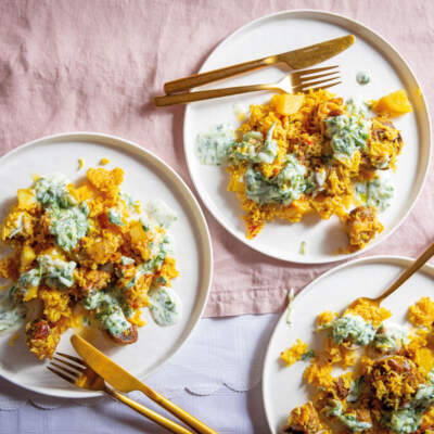 Akni with tomato-and-onion salad and dhay