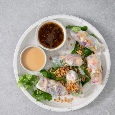 Rainbow slaw rolls with peanut satay dressing and Asian dressing