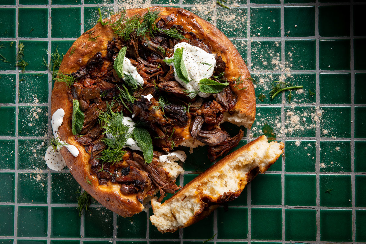 Thick-crust lamb pizza