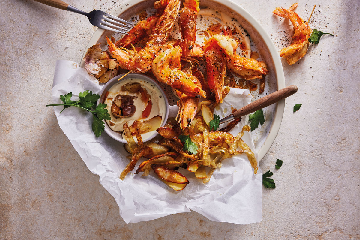 ALT-AND-PEPPER PRAWNS WITH SLOW-ROASTED GARLIC AÏOLI AND POTATO SKINS