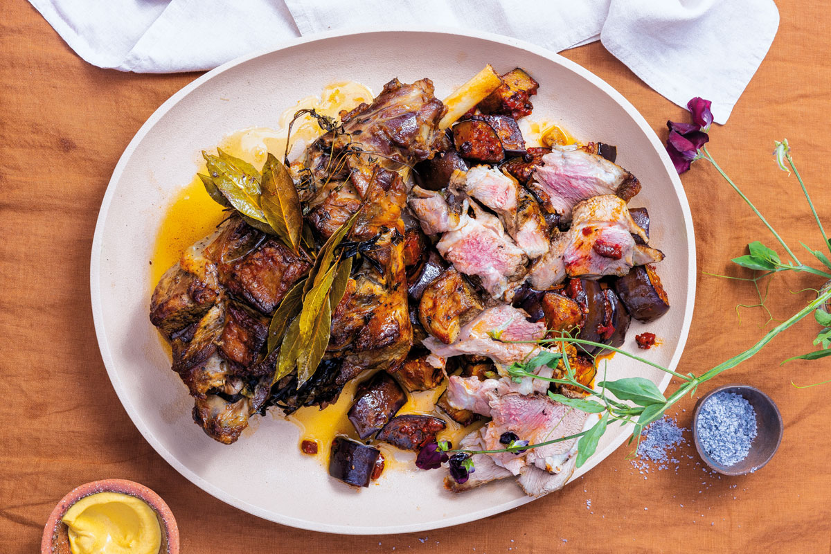 Herby roast lamb with harissa brinjals