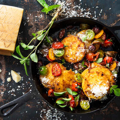 Grana Padano polenta cakes with exotic tomatoes and olives